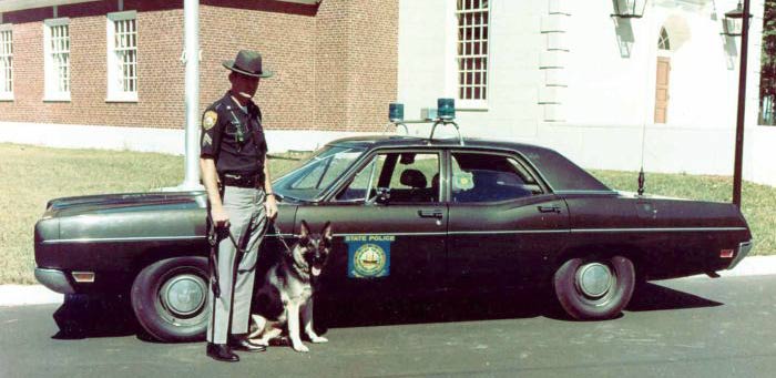 New Hampshire police officers and car