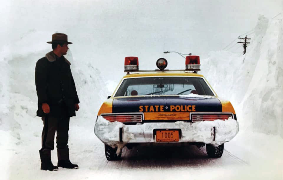 New York police troop and car surrounded by snow